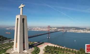 Towering Cristo Rei statue overlooking Lisbon, part of a tour by Tour Map Portugal