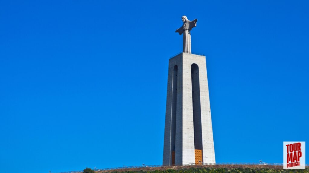 Towering Cristo Rei statue overlooking Lisbon, part of a tour by Tour Map Portugal