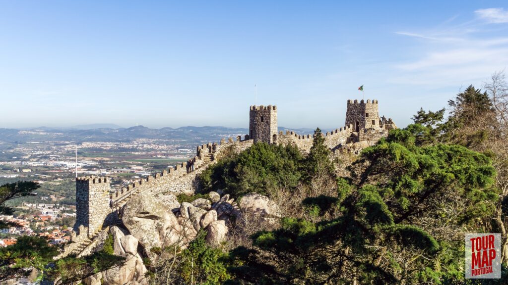 Historic walls and towers of the Moorish Castle in Sintra. Built in the 8th century, this ancient fortress stands as a testament to Sintra’s rich history. Its rugged walls and towers provide breathtaking views over Sintra and the surrounding forests, blending natural beauty with historical significance with Tour Map Portugal.