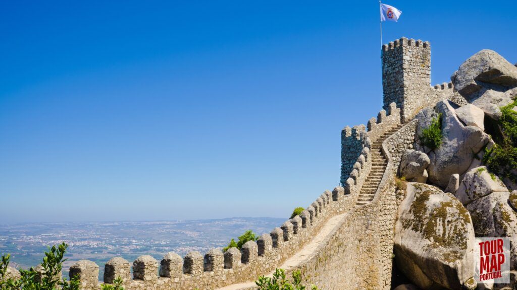 Historic walls and towers of the Moorish Castle in Sintra. Built in the 8th century, this ancient fortress stands as a testament to Sintra’s rich history. Its rugged walls and towers provide breathtaking views over Sintra and the surrounding forests, blending natural beauty with historical significance with Tour Map Portugal.