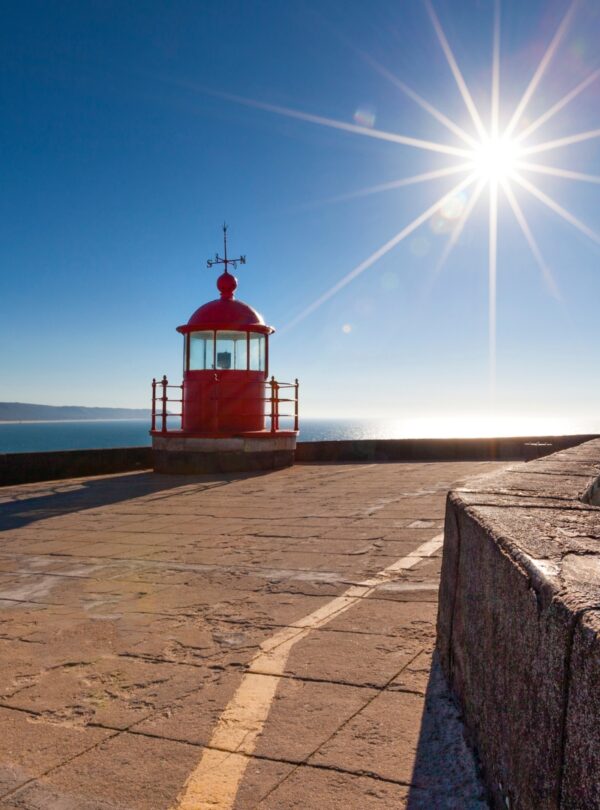 Coastal town of Nazaré, Portugal, known for giant waves and beach views with Tour Map Portugal.