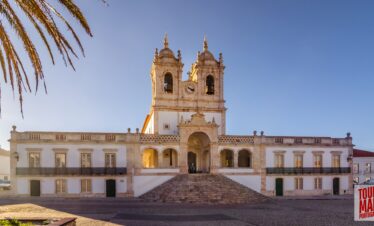 Coastal town of Nazaré, Portugal, known for giant waves and beach views with Tour Map Portugal.