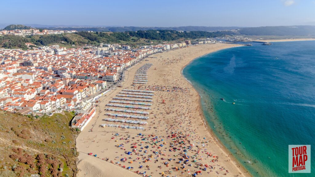 Coastal town of Nazaré, Portugal, known for giant waves and beach views with Tour Map Portugal.