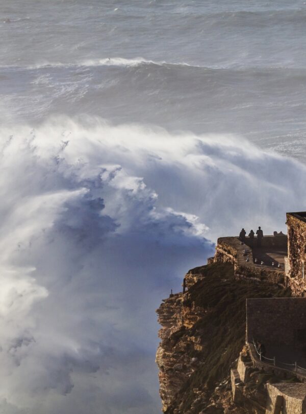 Coastal town of Nazaré, Portugal, known for giant waves and beach views with Tour Map Portugal.