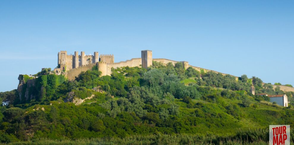 Step into the medieval charm of Óbidos, Portugal’s picturesque walled town, where history and festivals come alive – experience it with Tour Map Portugal