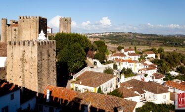 Historic town of Obidos, Portugal with scenic views and cobblestone streets on a Tour Map Portugal tour