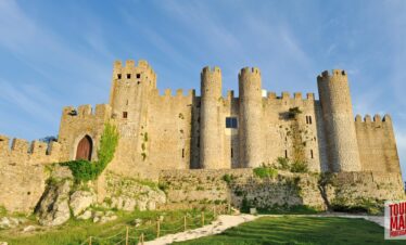 Historic town of Obidos, Portugal with scenic views and cobblestone streets on a Tour Map Portugal tour