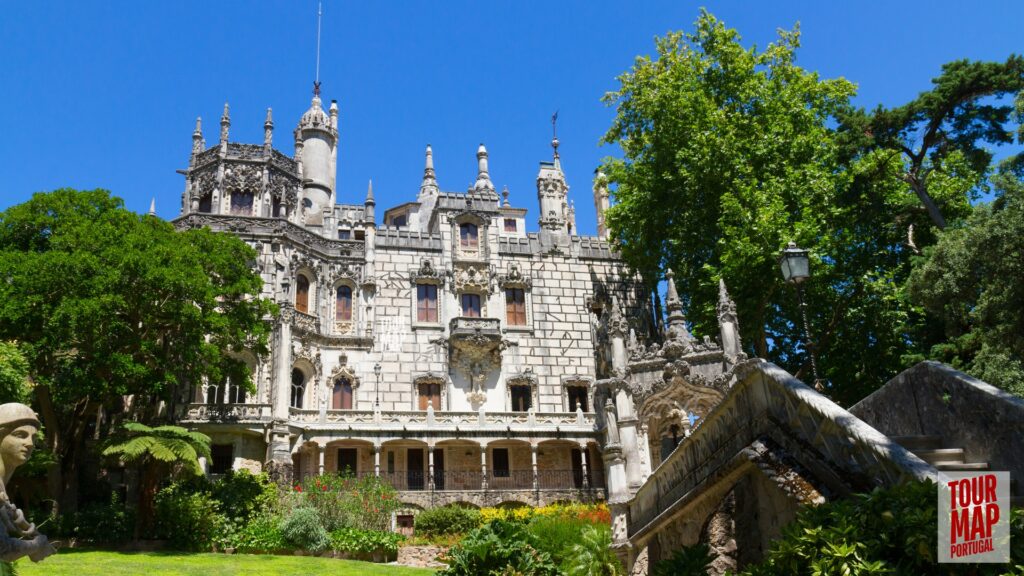 Gothic architecture and lush gardens of Quinta da Regaleira. Known for its elaborate Gothic-style architecture and enigmatic gardens, this UNESCO site is filled with hidden tunnels, lakes, and the iconic Initiation Well, offering an otherworldly experience steeped in symbolism and mystery with Tour Map Portugal.