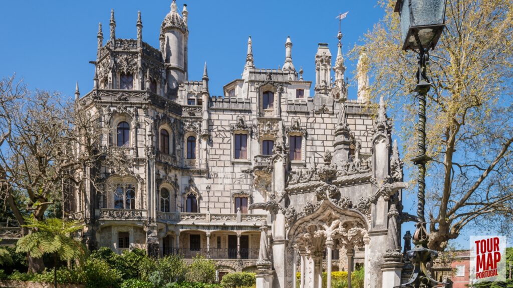 Gothic architecture and lush gardens of Quinta da Regaleira. Known for its elaborate Gothic-style architecture and enigmatic gardens, this UNESCO site is filled with hidden tunnels, lakes, and the iconic Initiation Well, offering an otherworldly experience steeped in symbolism and mystery with Tour Map Portugal.