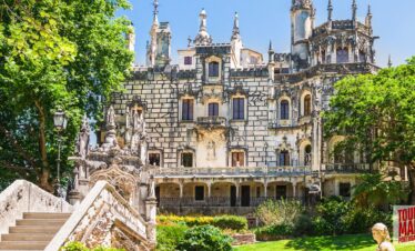 Gothic architecture and lush gardens of Quinta da Regaleira. Known for its elaborate Gothic-style architecture and enigmatic gardens, this UNESCO site is filled with hidden tunnels, lakes, and the iconic Initiation Well, offering an otherworldly experience steeped in symbolism and mystery with Tour Map Portugal.