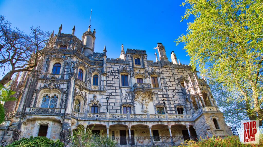 Gothic architecture and lush gardens of Quinta da Regaleira. Known for its elaborate Gothic-style architecture and enigmatic gardens, this UNESCO site is filled with hidden tunnels, lakes, and the iconic Initiation Well, offering an otherworldly experience steeped in symbolism and mystery with Tour Map Portugal.