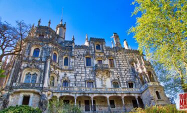 Gothic architecture and lush gardens of Quinta da Regaleira. Known for its elaborate Gothic-style architecture and enigmatic gardens, this UNESCO site is filled with hidden tunnels, lakes, and the iconic Initiation Well, offering an otherworldly experience steeped in symbolism and mystery with Tour Map Portugal.