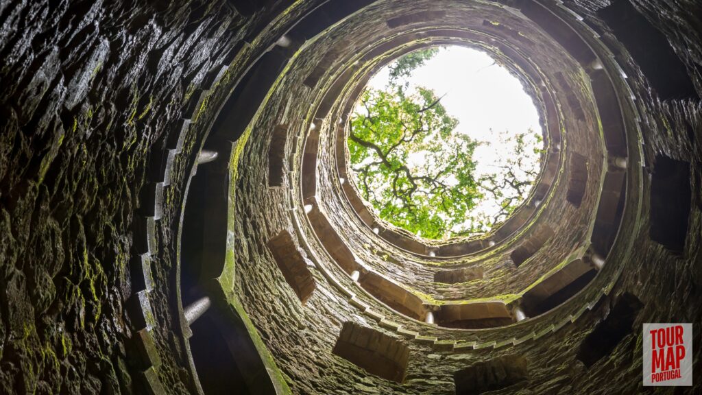 Gothic architecture and lush gardens of Quinta da Regaleira. Known for its elaborate Gothic-style architecture and enigmatic gardens, this UNESCO site is filled with hidden tunnels, lakes, and the iconic Initiation Well, offering an otherworldly experience steeped in symbolism and mystery.